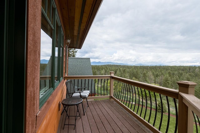 deck featuring a wooded view