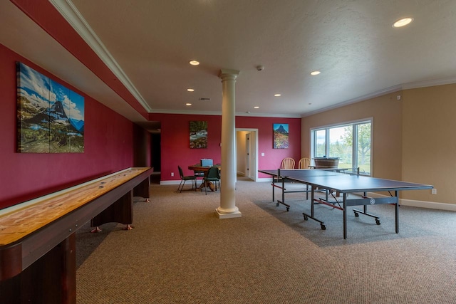 recreation room with ornate columns, baseboards, ornamental molding, and light colored carpet