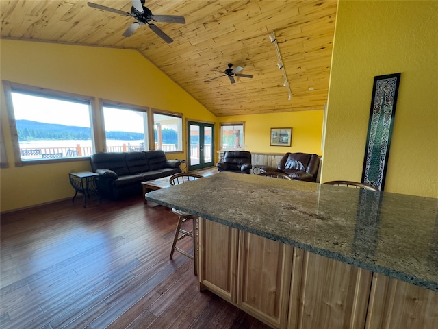 kitchen featuring dark wood-type flooring, open floor plan, wooden ceiling, and vaulted ceiling