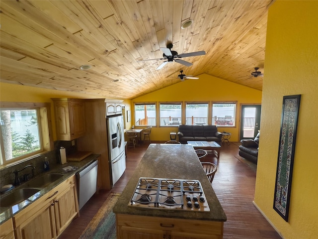 kitchen with wooden ceiling, stainless steel appliances, ceiling fan, dark countertops, and lofted ceiling