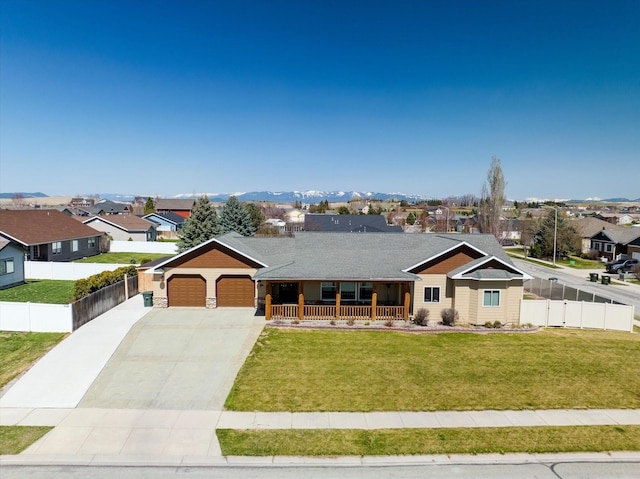 view of front of house featuring a garage, a front yard, concrete driveway, a porch, and a residential view
