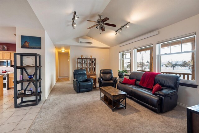 living room featuring a ceiling fan, rail lighting, a wall unit AC, and lofted ceiling