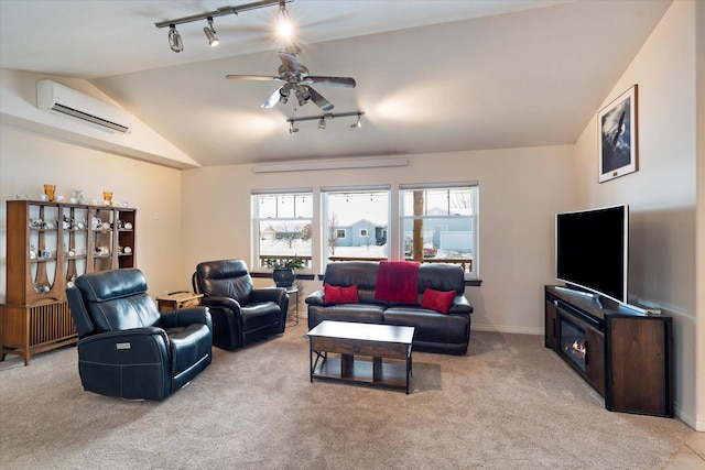 living room with a wall mounted air conditioner, light colored carpet, rail lighting, a ceiling fan, and vaulted ceiling