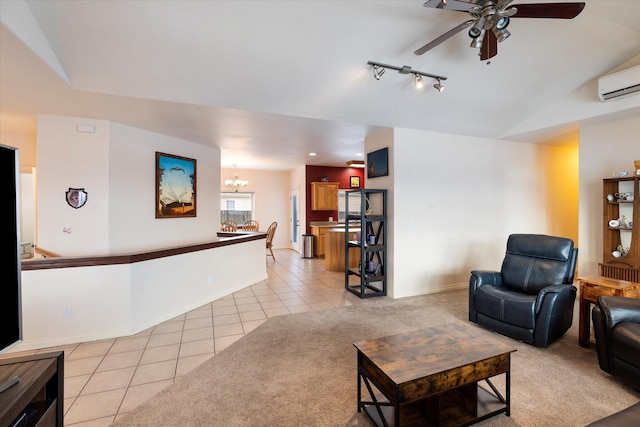 living area featuring light tile patterned floors, baseboards, ceiling fan with notable chandelier, and an AC wall unit