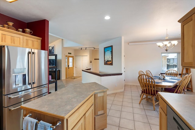 kitchen featuring an inviting chandelier, light brown cabinets, baseboards, light tile patterned floors, and stainless steel refrigerator with ice dispenser