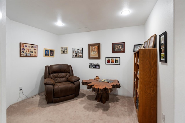 sitting room featuring carpet flooring and recessed lighting