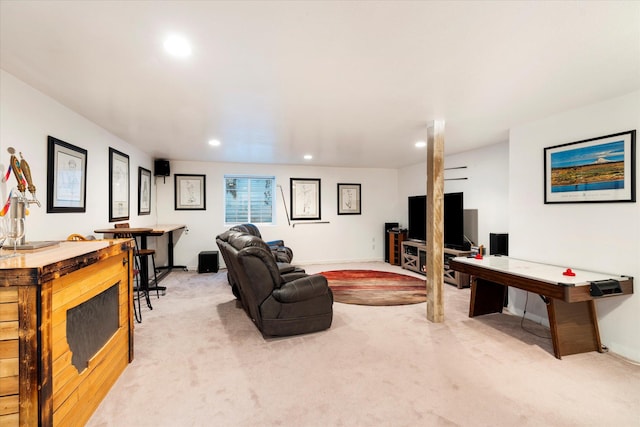 living area featuring recessed lighting and light colored carpet