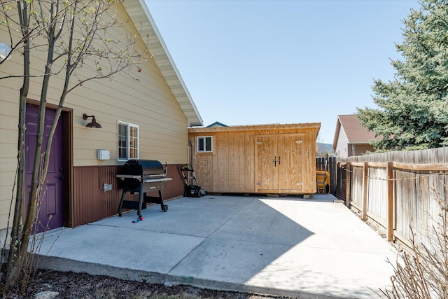 view of patio / terrace with a fenced backyard and a grill