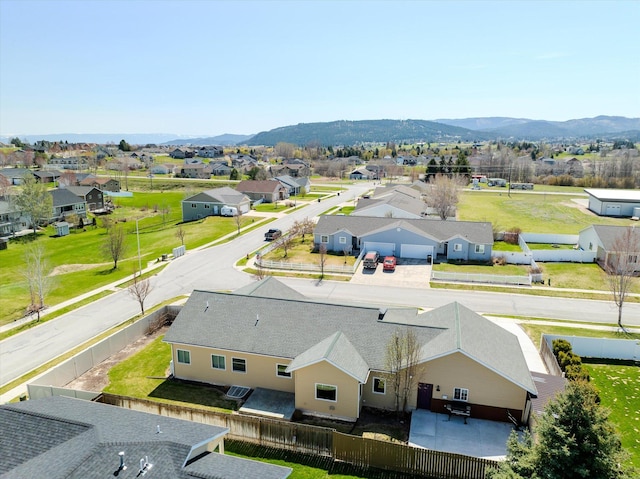 drone / aerial view with a residential view and a mountain view