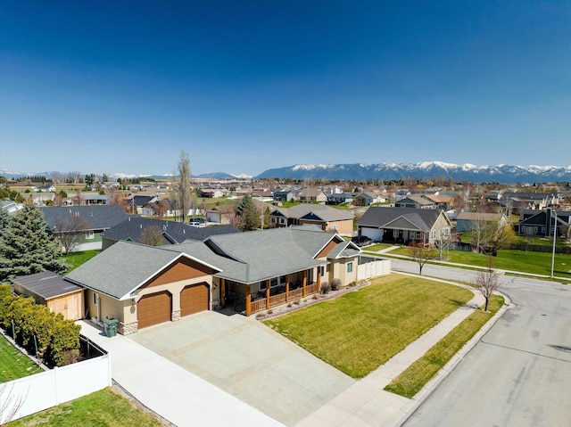 drone / aerial view with a residential view and a mountain view