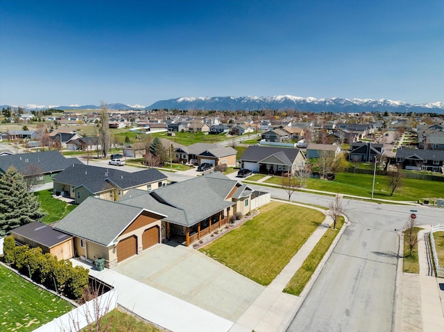 aerial view featuring a mountain view and a residential view