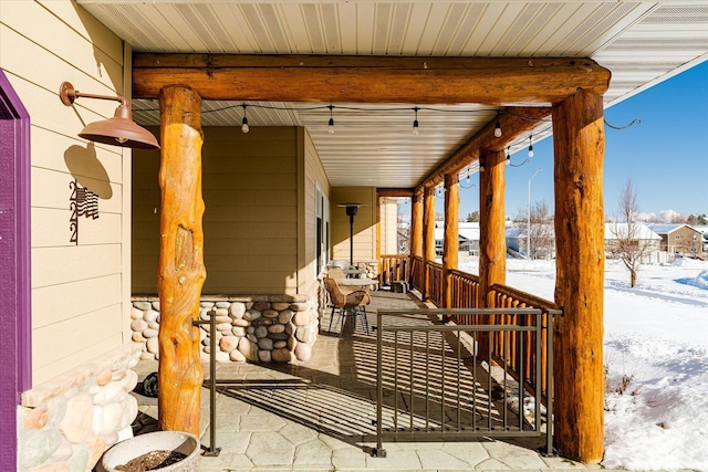 view of snow covered patio