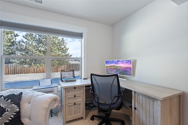 office area featuring light colored carpet