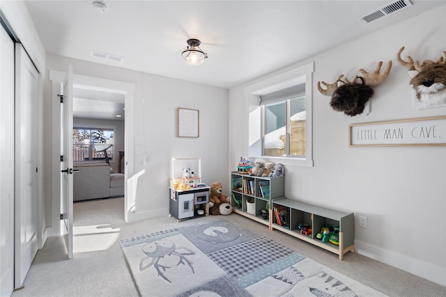 playroom featuring baseboards, visible vents, and carpet flooring