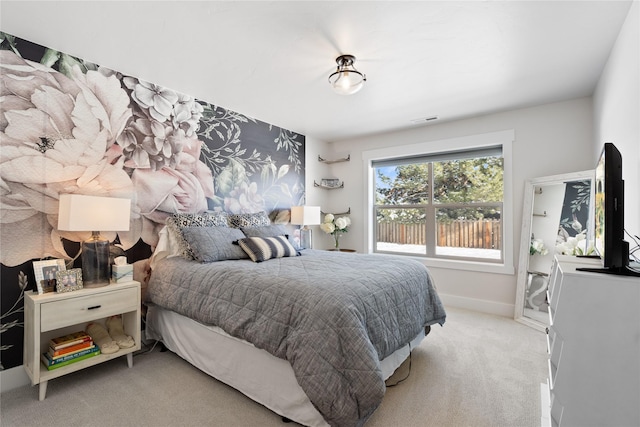 bedroom featuring baseboards, visible vents, and carpet floors