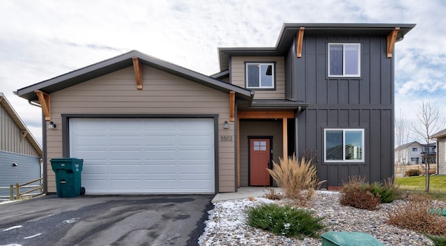 view of front of property with driveway, a garage, and board and batten siding