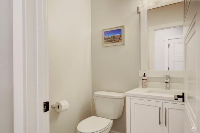 half bath with toilet and vanity