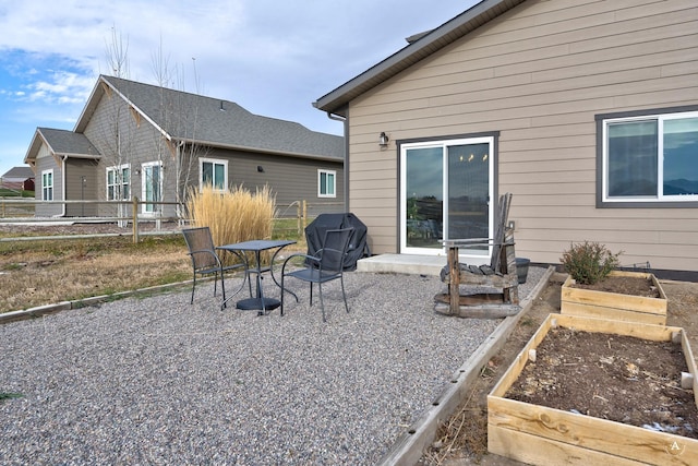 rear view of house with a patio area and a garden