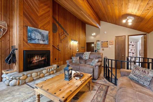 living room with a large fireplace, wood ceiling, wooden walls, and high vaulted ceiling