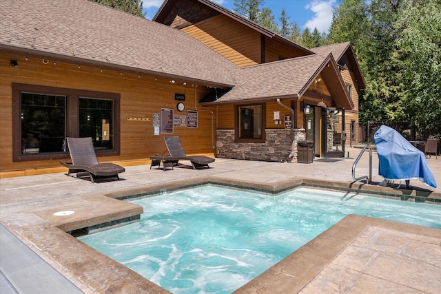 view of swimming pool with a patio