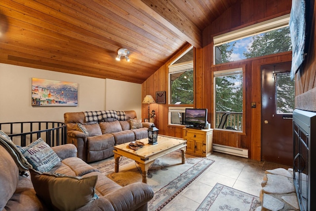 living area with a healthy amount of sunlight, light tile patterned floors, a baseboard radiator, and wood ceiling