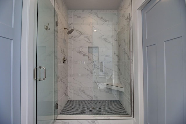 bathroom featuring a shower stall