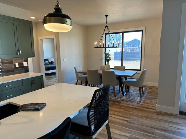 156 Antler Peak Ln, Kalispell, MT 59901 - dining area featuring a chandelier and wood finished floors