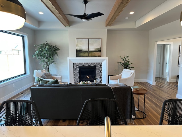 156 Antler Peak Ln, Kalispell, MT 59901 - living room featuring beam ceiling, ceiling fan, dark wood-style flooring, a fireplace, and recessed lighting
