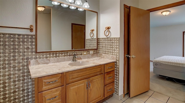 full bath with vanity and tile patterned floors