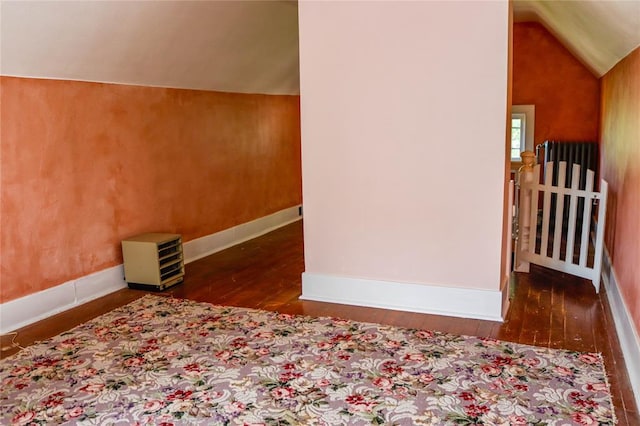 202 3rd St, Havre, MT 59501 - additional living space featuring hardwood / wood-style flooring, lofted ceiling, and radiator heating unit