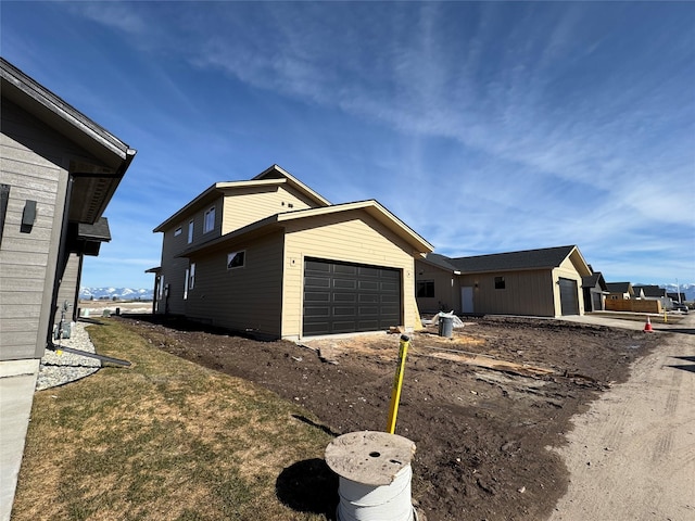 view of property exterior featuring a garage