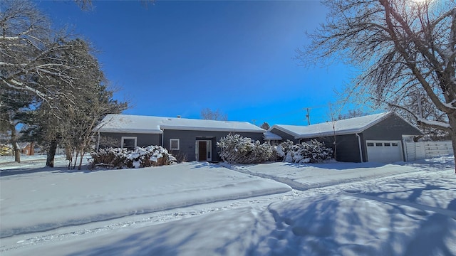 ranch-style house featuring an attached garage