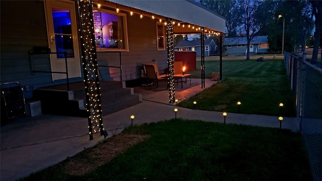 view of home's exterior featuring a patio area, a yard, and fence