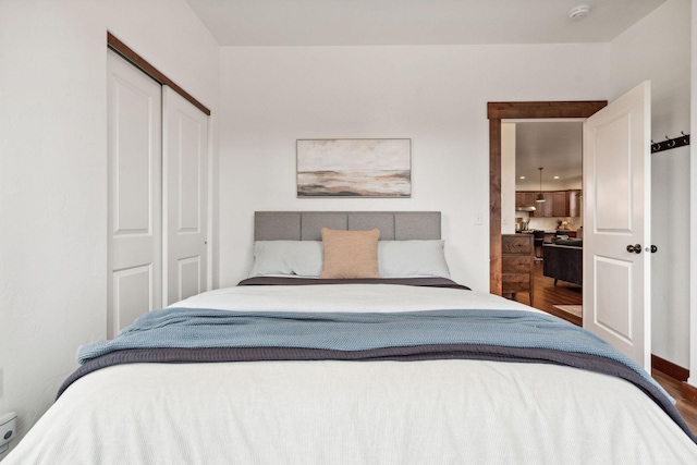 bedroom with a closet and wood finished floors