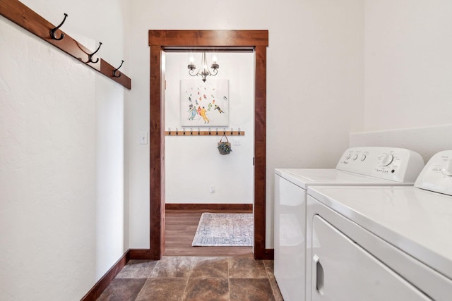 laundry room featuring laundry area, baseboards, and separate washer and dryer