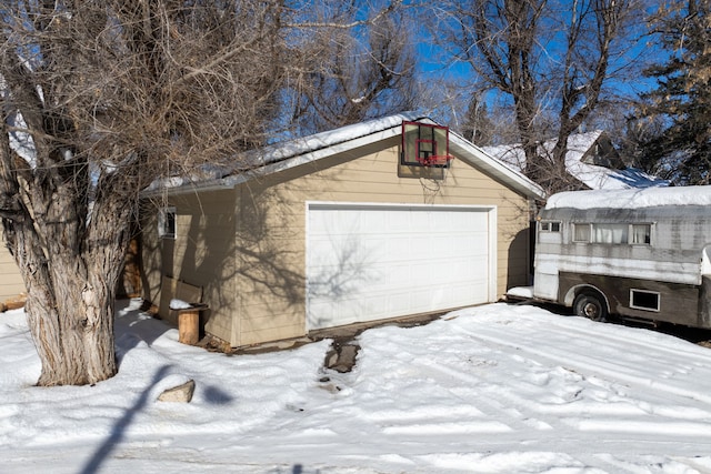 view of snow covered garage