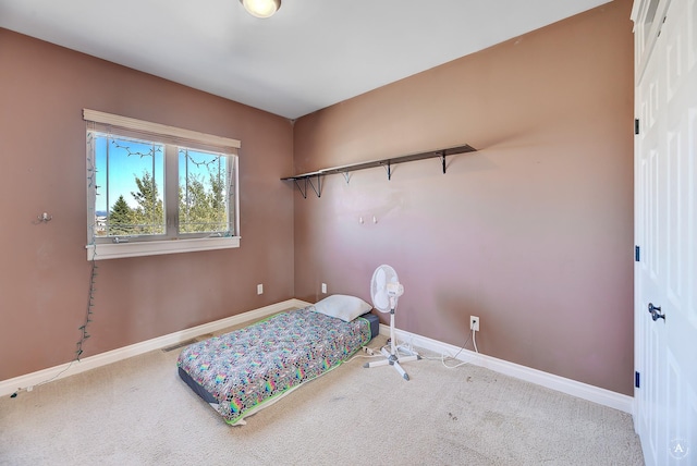 carpeted bedroom with baseboards