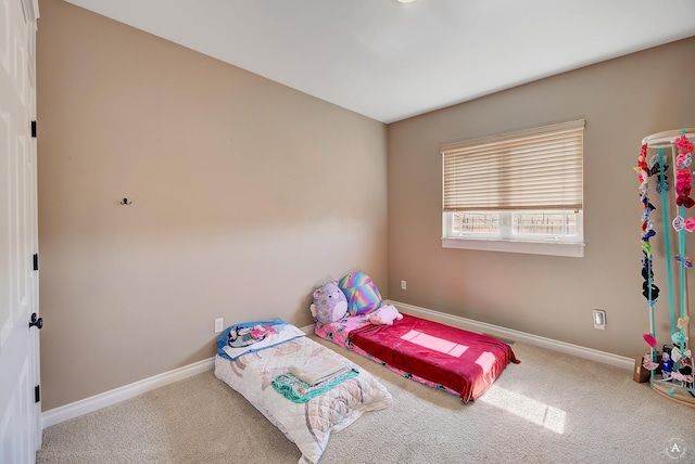 bedroom with carpet and baseboards