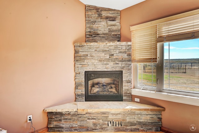 room details featuring a stone fireplace