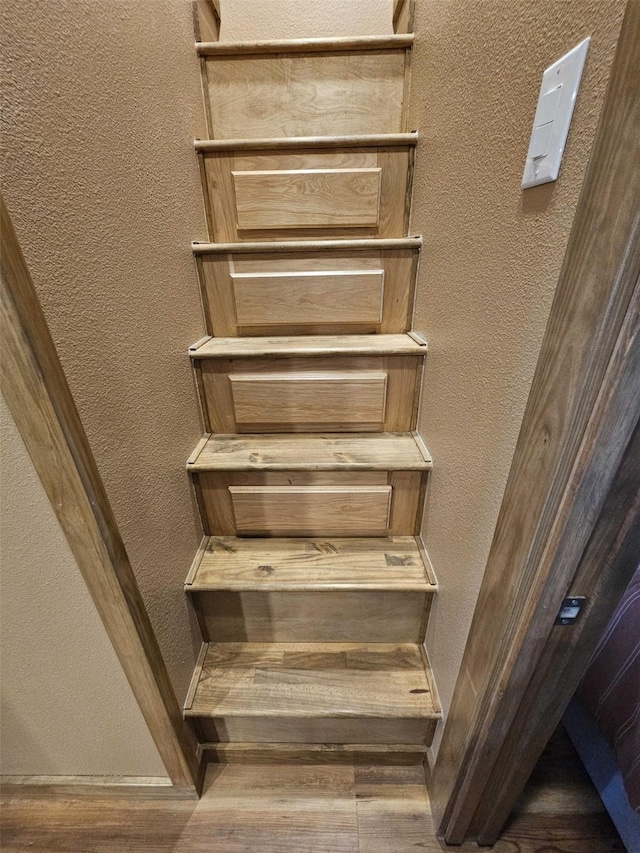 301 Kingfisher Loop, Eureka, MT 59917 - stairs featuring wood finished floors and a textured wall