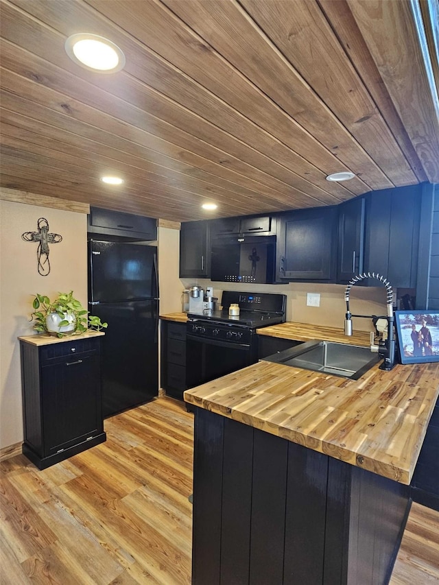 301 Kingfisher Loop, Eureka, MT 59917 - kitchen with black appliances, butcher block counters, a sink, light wood-style flooring, and wooden ceiling