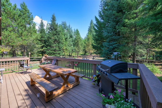 wooden terrace featuring outdoor dining area