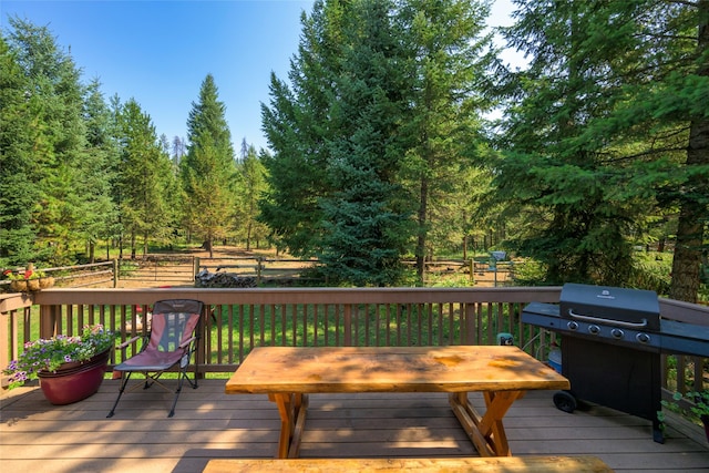 wooden deck featuring area for grilling