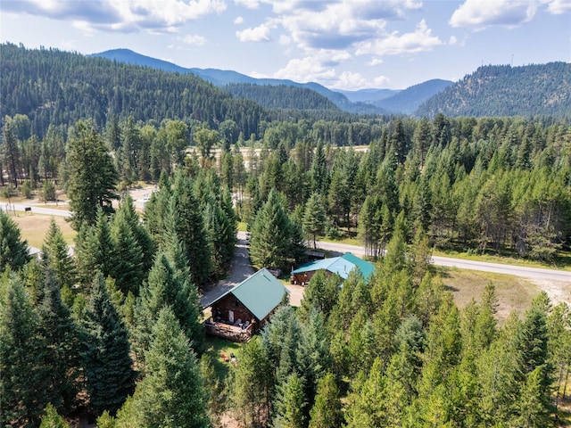 drone / aerial view with a forest view and a mountain view