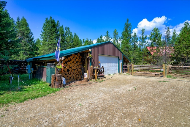 detached garage featuring driveway