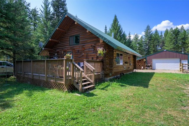 rear view of property with an outbuilding, a yard, a deck, and log siding