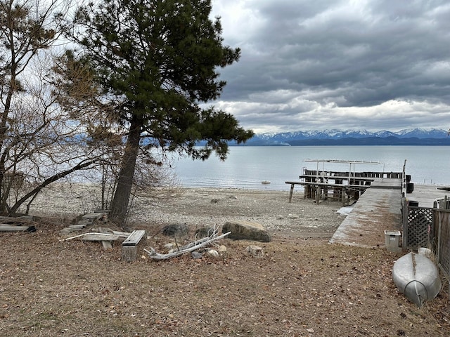 dock area featuring a water and mountain view