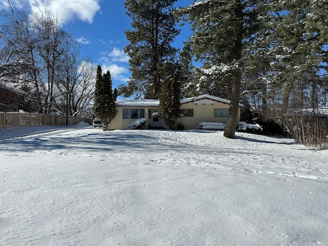 view of front of house featuring fence