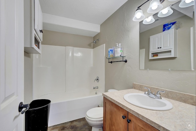 bathroom featuring toilet, shower / bathtub combination, vanity, and a textured wall