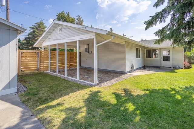 exterior space featuring a yard and fence